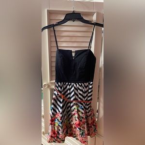Mini dress; black and white stripes; floral pattern; waist belt